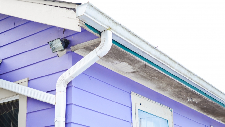 gutters and downspout on purple house